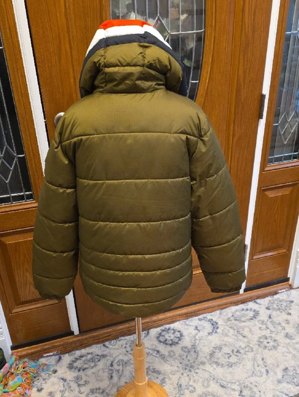 Levi's Olive Green Kids Puffer Jacket with Red and White Hood Trim